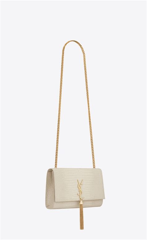 KATE MEDIUM TASSEL IN CROCODILE.